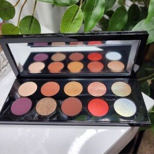 Pat McGrath Luxe Eyeshadow Palette with Red, Gold, and Purple Hues